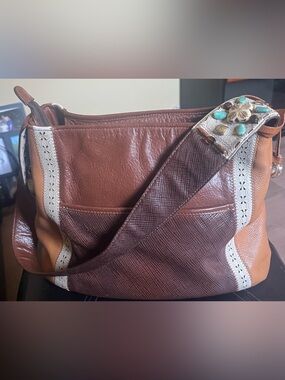 Like new Brown Leather tote with beautiful beaded strap work.